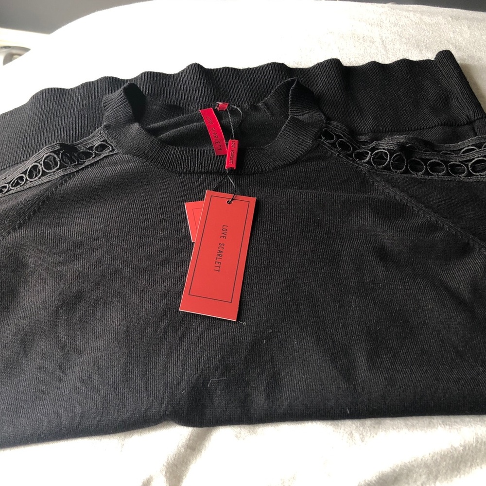Black peek a doo sweater.